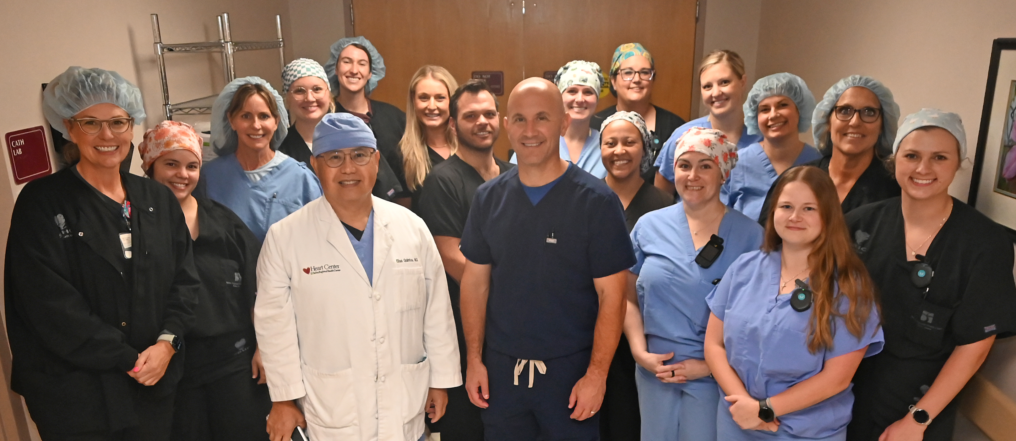 Salina Regional Health Center Cath Lab team gathered together in clinical attire
