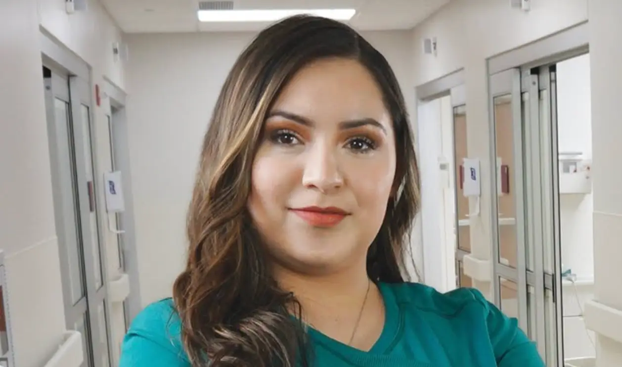 A Salina Regional Health Center registered nurse in a hospital corridor