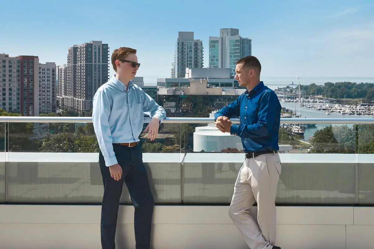 Two Spectrum employees talking outside a Spectrum office