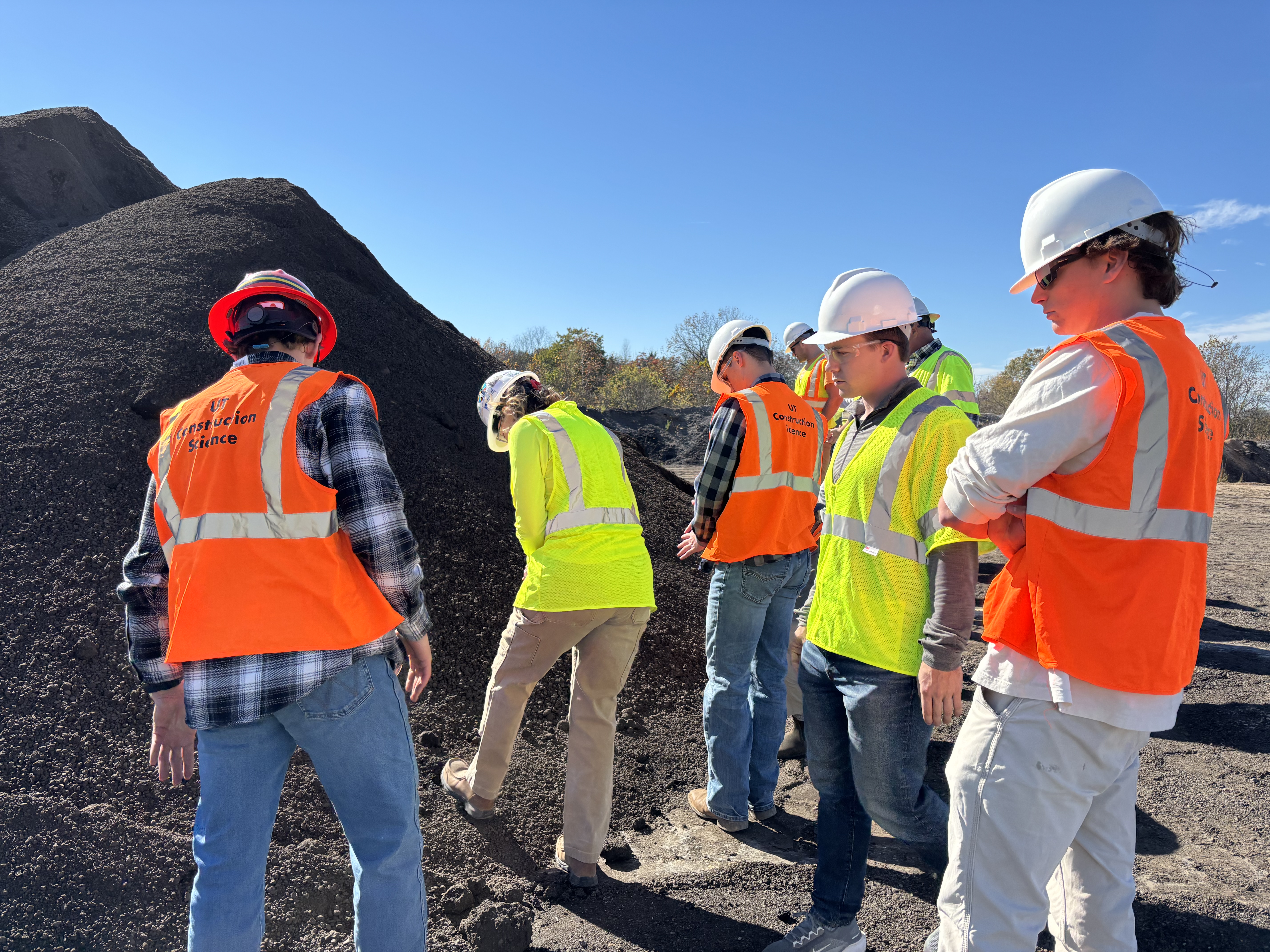 Students wearing safety equipment during a hands-on Thompson-Arthur site visit