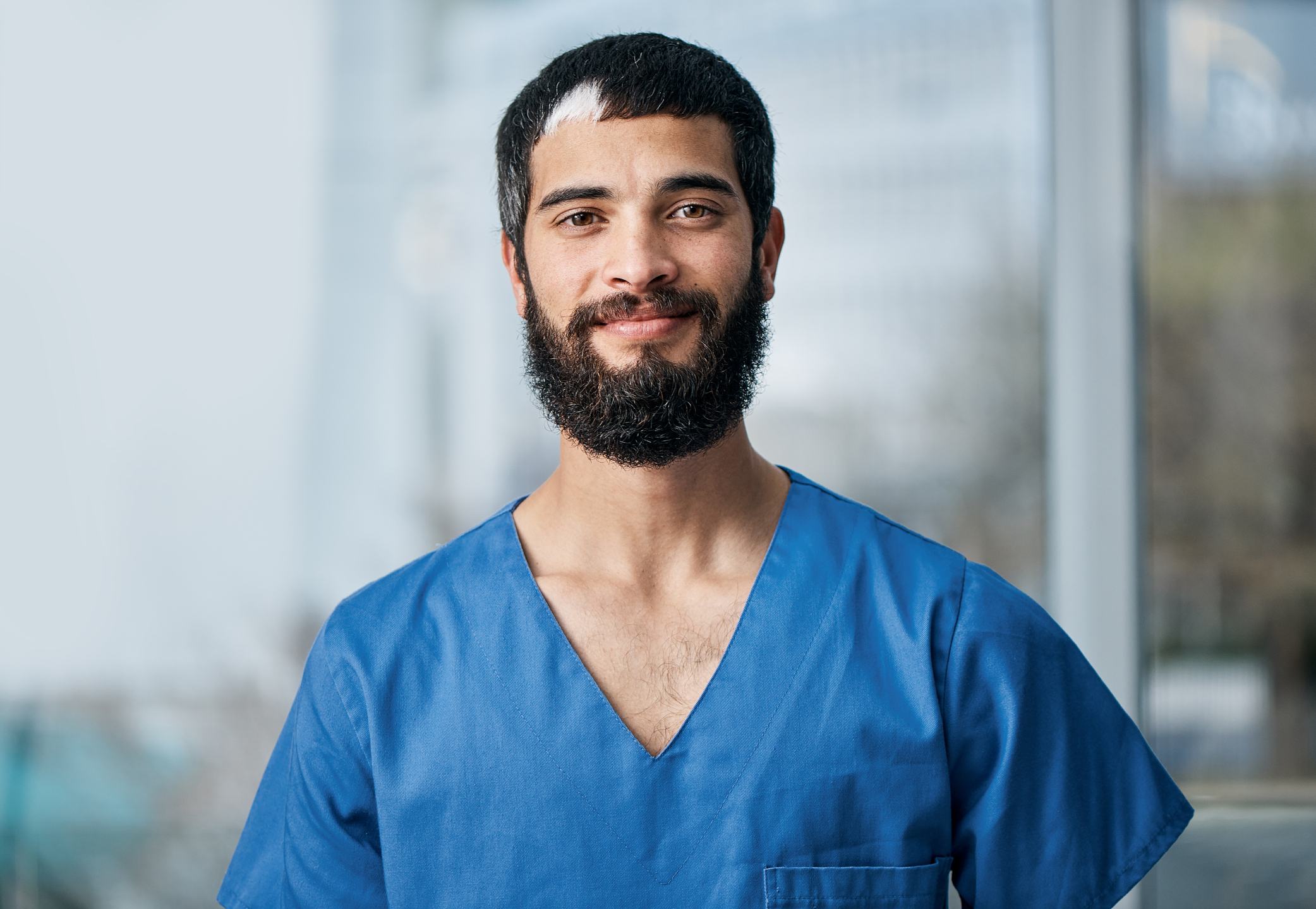 Charles River colleague wearing medical scrubs