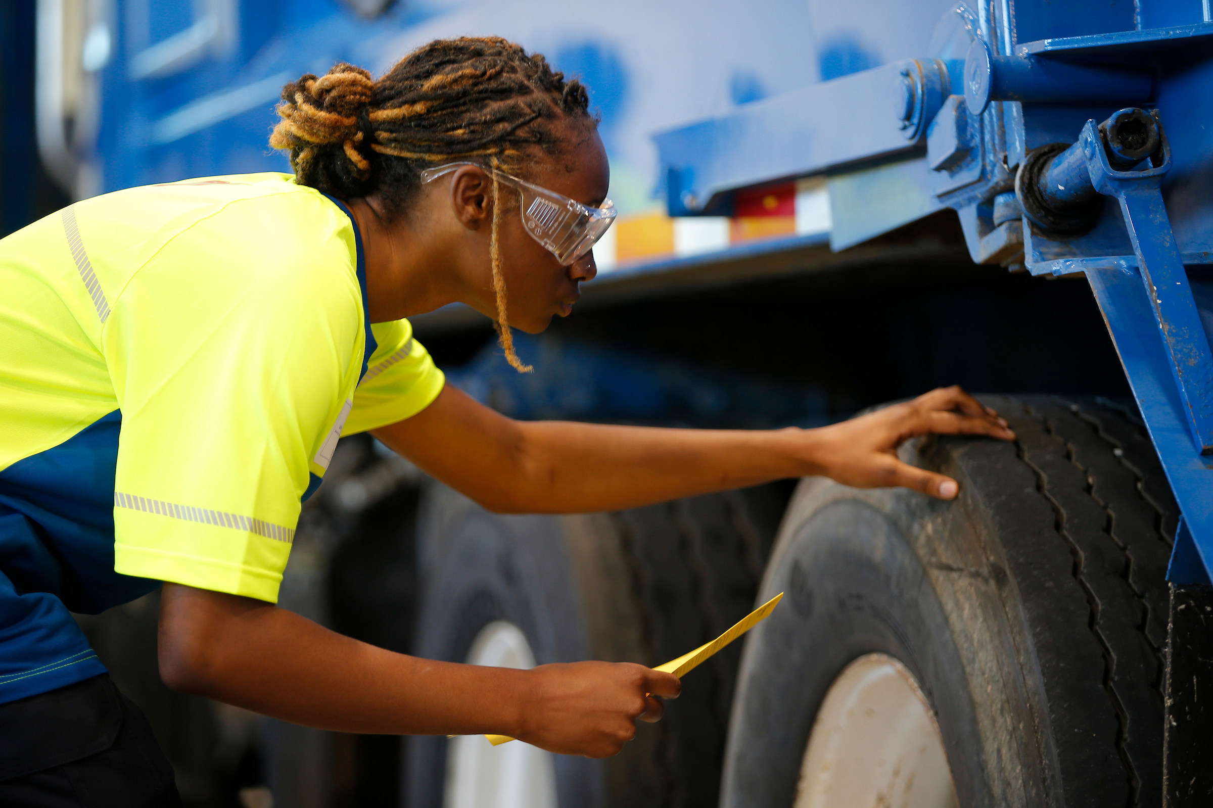 Republic Services Technical Institute student inspecting a collection truck tire
